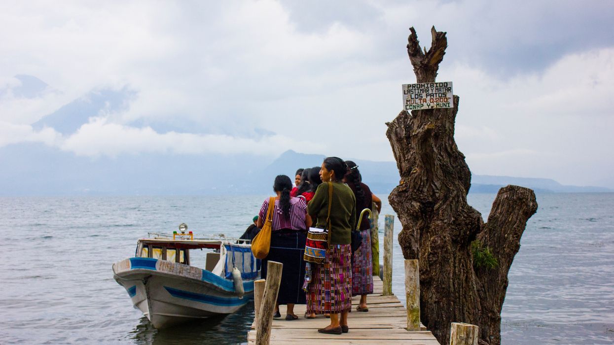women getting on boat