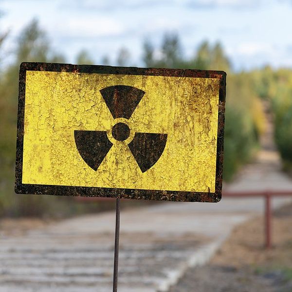 Yellow and black radioactive warning sign.