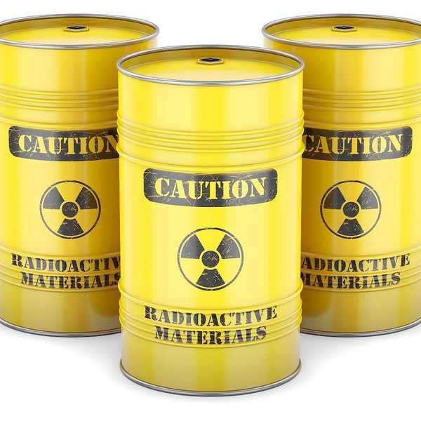 Yellow barrels labeled "CAUTION Radioactive Materials" in black letters