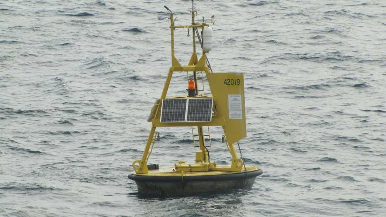 Yellow meteorological buoy floating in the western Gulf of Mexico