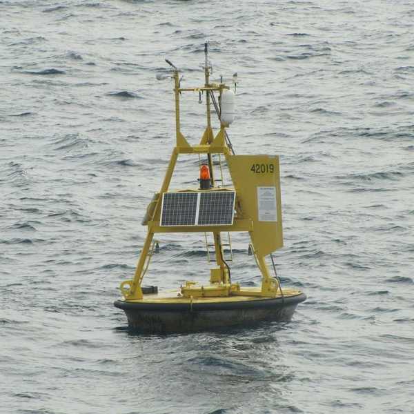 Yellow meteorological buoy floating in the western Gulf of Mexico