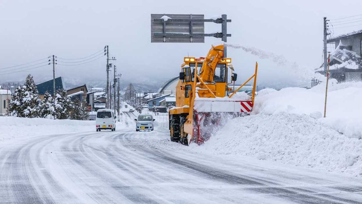 Yellow snow removal equipment clearing winter streets